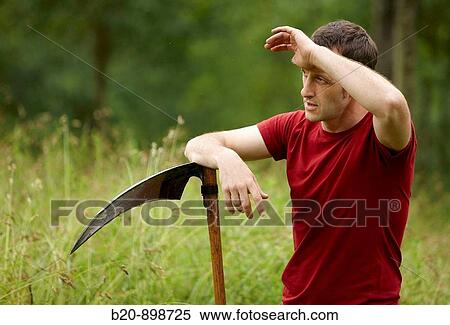 Stock Photography - Man with scythe, hand tool, farming, Guipuzcoa, Basque Country, Spain. Fotosearch