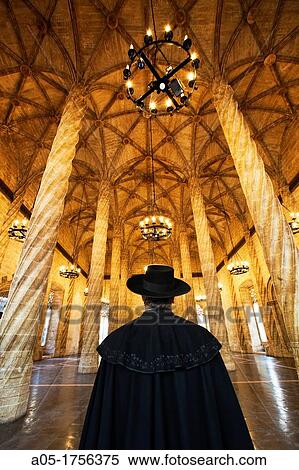 Stock Photography - Man with spanish cape La Lonja de la Seda Silk Exchange World Heritage Site by UNESCO 16th century Valencia Comunidad Valenciana Spain.. Fotosearch
