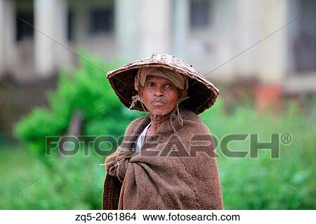 Man with straw hat. Baiga Tribe, Chada village, Madhya Pradesh, India. View Large Photo Image Picture - Man with straw hat. Baiga Tribe, Chada village, Madhya Pradesh, India.. Fotosearch