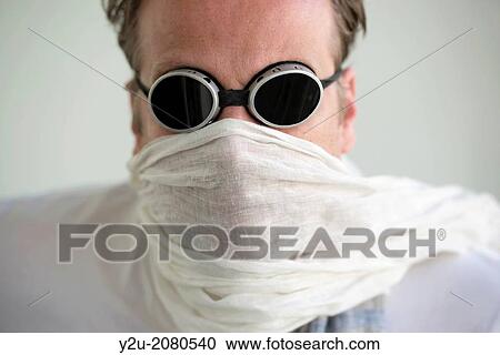 Man with sunglasses and a scarf cover his face. View Large Photo Image Stock Image - Man with sunglasses and a scarf cover his face.. Fotosearch
