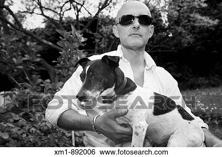 Man with sunglasses and Jack Russell dog View Large Photo Image Stock Photograph - Man with sunglasses and Jack Russell dog. Fotosearch