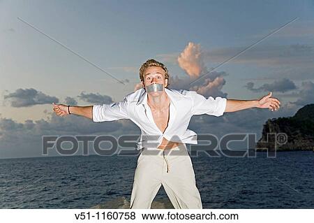 Man with tape over his mouth outdoor View Large Photo Image Stock Photo - Man with tape over his mouth outdoor. Fotosearch