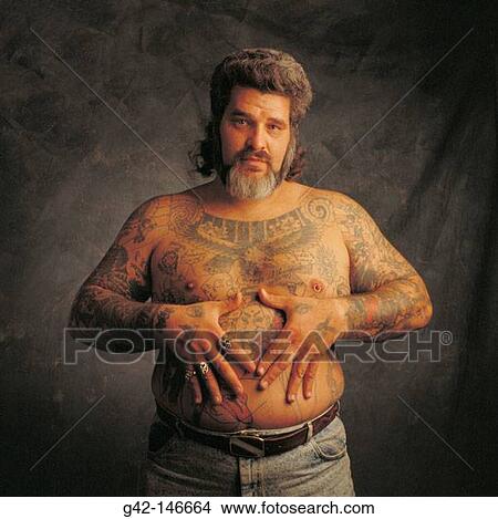Man with tatoos and piercing View Large Photo Image Picture - Man with tatoos and piercing. Fotosearch