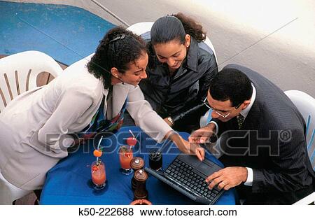 Man with two women in business meeting View Large Photo Image Stock Photo - Man with two women in business meeting. Fotosearch
