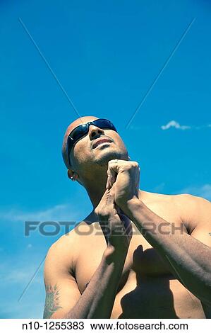 Man without a shirt wearing sunglasses View Large Photo Image Stock Image - Man without a shirt wearing sunglasses. Fotosearch