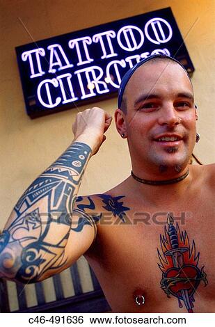 Stock Photograph - Man Working in a Tattoo Parlour, South Beach. Miami, Florida. USA. Fotosearch