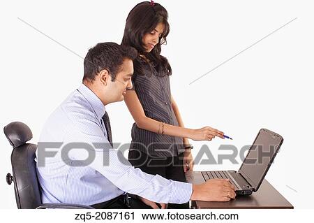 Manager in discussion with his assistant, Pune, India. View Large Photo Image Stock Image - Manager in discussion with his assistant, Pune, India.. Fotosearch