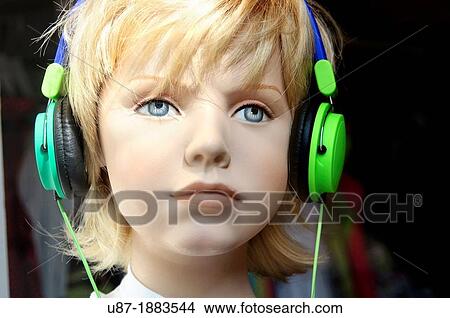 Picture - Manekin Boy Head Wearing Headphones. Fotosearch