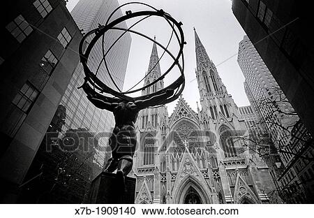 Manhattan, New York, USA The Atlas Statue outside the Rockefeller Center, facing St Patrick's Cathedral Atlas carries the heavens on his shoulders, designed & cast in 1936 by Lee Lawrie & Rene Chambellan View Large Photo Image Stock Image - Manhattan, New York, USA The Atlas Statue outside the Rockefeller Center, facing St Patrick's Cathedral Atlas carries the heavens on his shoulders, designed & cast in 1936 by Lee Lawrie & Rene Chambellan. Fotosearch