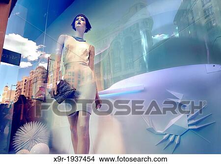 Mannequin and reflections at a window shop in Gran Via avenue. Madrid. Spain View Large Photo Image Picture - Mannequin and reflections at a window shop in Gran Via avenue. Madrid. Spain. Fotosearch