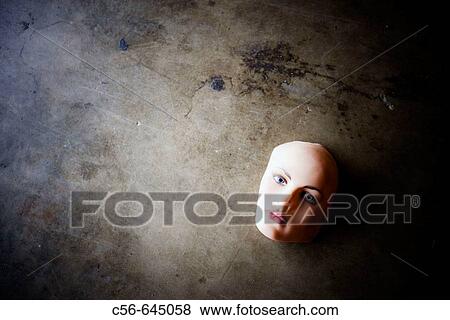 Mannequin face on concrete floor View Large Photo Image Stock Photo - Mannequin face on concrete floor. Fotosearch