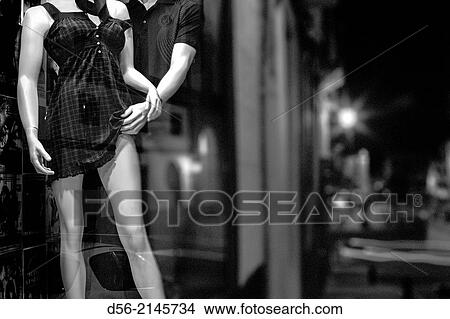 Mannequins in a shop window at night, old town CBceres, Extremadura, Spain View Large Photo Image Picture - Mannequins in a shop window at night, old town CBceres, Extremadura, Spain. Fotosearch