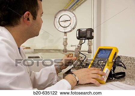 Stock Image - Manometer calibration. Calibration Laboratory. Technology and Research Centre. Inasmet-Tecnalia Foundation, San Sebastian, Gipuzkoa, Euskadi. Spain.. Fotosearch