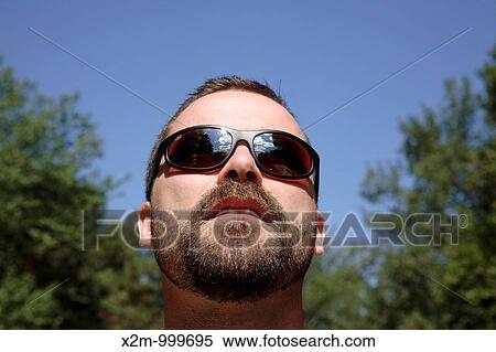 Stock Photography - Man's face with beard. Fotosearch