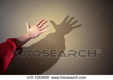 Man's hand and shadow View Large Photo Image Stock Image - Man's hand and shadow. Fotosearch