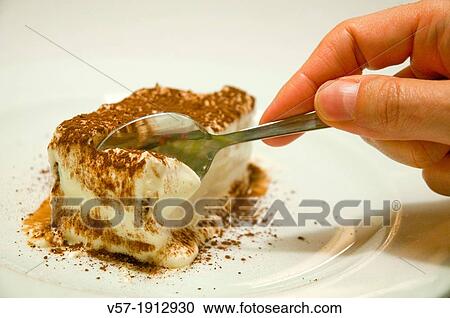 Man's hand having a portion of tiramisu, typical Italian dessert. Close view. View Large Photo Image Stock Image - Man's hand having a portion of tiramisu, typical Italian dessert. Close view.. Fotosearch
