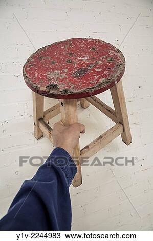 Man's hand holding a small stool. View Large Photo Image Stock Image - Man's hand holding a small stool.. Fotosearch