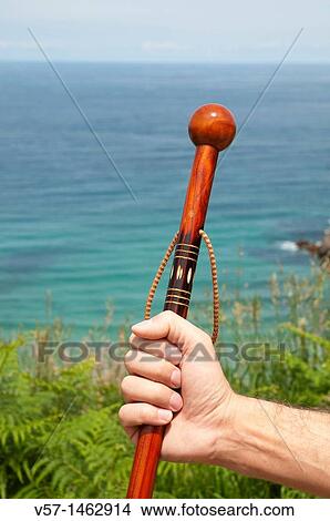 Man's hand holding a walking stick View Large Photo Image Picture - Man's hand holding a walking stick. Fotosearch