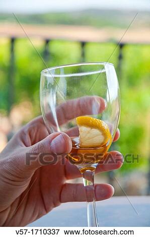 Man's hand holding an empty glass View Large Photo Image Stock Photo - Man's hand holding an empty glass. Fotosearch