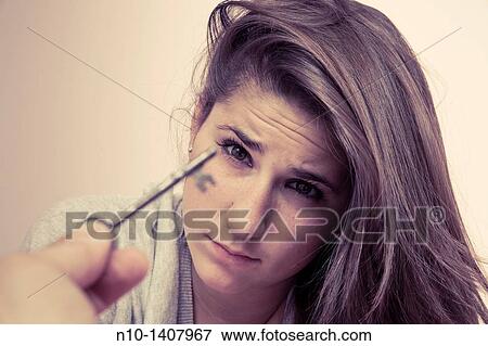 Man's hand holding an old key in front of a teen girl View Large Photo Image Stock Photo - Man's hand holding an old key in front of a teen girl. Fotosearch