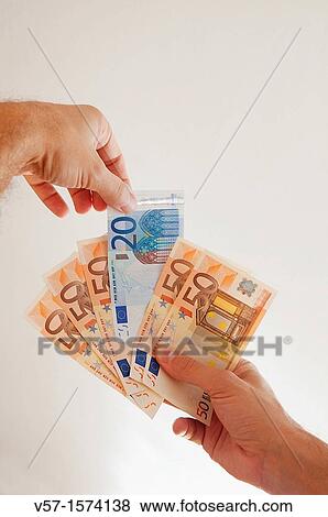 Man's hand playing cards with bank notes View Large Photo Image Stock Photo - Man's hand playing cards with bank notes. Fotosearch