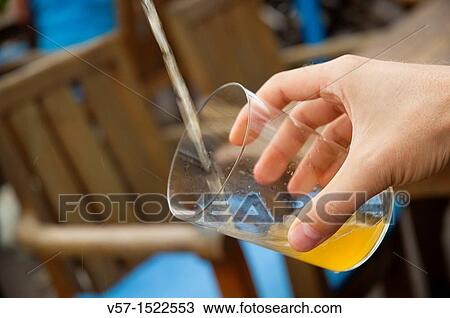Man's hand serving cider. Asturias, Spain. View Large Photo Image Stock Image - Man's hand serving cider. Asturias, Spain.. Fotosearch