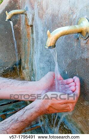 Man's hand under sparkling drinking water of a fountain View Large Photo Image Stock Image - Man's hand under sparkling drinking water of a fountain. Fotosearch