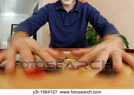Man's hands on Carom board game, Marseille, france View Large Photo Image Stock Photo - Man's hands on Carom board game, Marseille, france. Fotosearch