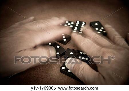 Man's hands playing with dominoes View Large Photo Image Stock Photography - Man's hands playing with dominoes. Fotosearch