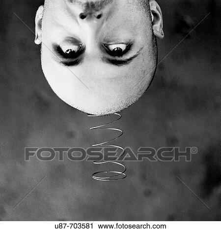 Man's head with a metal spring close up. View Large Photo Image Stock Image - Man's head with a metal spring close up.. Fotosearch