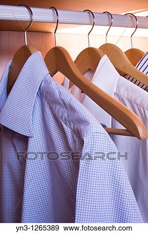 Man's shirts in the closet View Large Photo Image Stock Photo - Man's shirts in the closet. Fotosearch