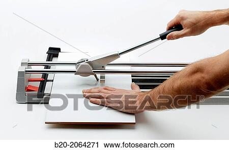Stock Image - Manual tile cutter. Cutting tile. Construction Industry.. Fotosearch