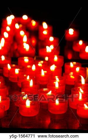 many lit candles in dark room in church View Large Photo Image Stock Image - many lit candles in dark room in church. Fotosearch