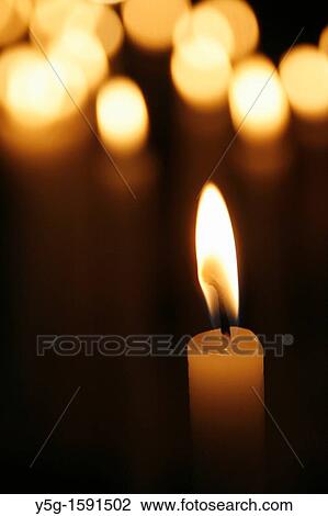 many lit candles in dark room in church View Large Photo Image Stock Image - many lit candles in dark room in church. Fotosearch