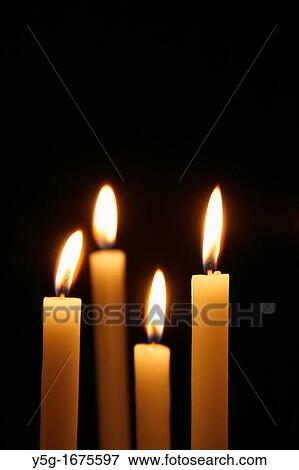 many lit candles in dark room in church View Large Photo Image Stock Photo - many lit candles in dark room in church. Fotosearch