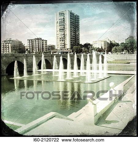Stock Image - Manzanares River and Madrid Park Fountains near Segovia Bridge. Madrid, Spain.. Fotosearch