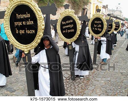Marchers in Holy Week procession with signs View Large Photo Image Stock Photography - Marchers in Holy Week procession with signs. Fotosearch