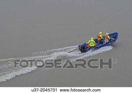 Stock Image - Marine police on duty, Kuching, Sarawak, Malaysia.. Fotosearch
