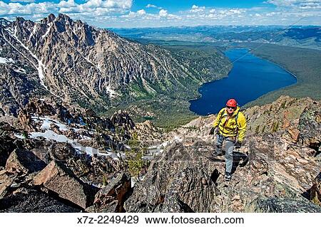 Mark Weber climbing the Chockstone Couloir, AKA the Boy Scout Couloir an alpine route which is rated Grade 3, Class 4 and located on The Grand Mogul in the Sawtooth Mountains in central Idaho. View Large Photo Image Stock Photo - Mark Weber climbing the Chockstone Couloir, AKA the Boy Scout Couloir an alpine route which is rated Grade 3, Class 4 and located on The Grand Mogul in the Sawtooth Mountains in central Idaho.. Fotosearch