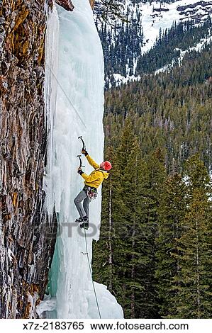 Mark Weber ice climbing a route called Thin Chance which is rated WI-4, 5 and located in Hyalite Canyon in the Gallatin Mountains near the city of Bozeman in southern Montana. View Large Photo Image Stock Photography - Mark Weber ice climbing a route called Thin Chance which is rated WI-4, 5 and located in Hyalite Canyon in the Gallatin Mountains near the city of Bozeman in southern Montana.. Fotosearch