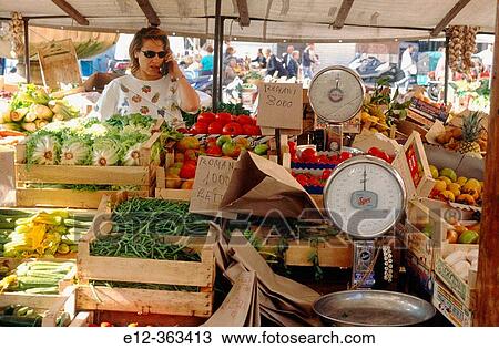 Market. Lady selling vegetables and talking on a mobile phone. Campo dei Fiori. Rome. Italy. View Large Photo Image Stock Image - Market. Lady selling vegetables and talking on a mobile phone. Campo dei Fiori. Rome. Italy.. Fotosearch