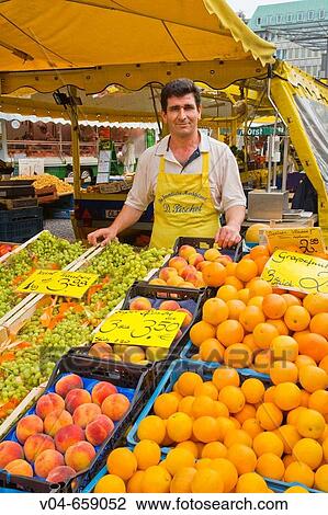 Market man in his stall View Large Photo Image Stock Image - Market man in his stall. Fotosearch