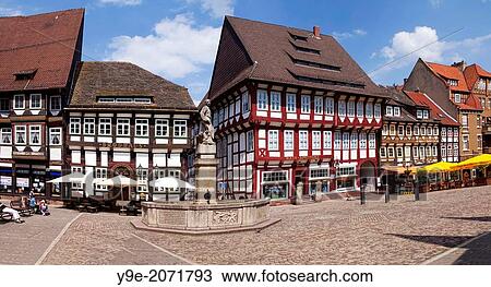 Stock Image - Market square with Till Eulenspiegel fountain in Einbeck, Lower Saxony, Germany, Europe. Fotosearch