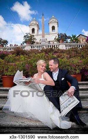 Married couple reading an Italian newspaper in Scalinata Trinit? dei Monti in Rome Italy View Large Photo Image Stock Image - Married couple reading an Italian newspaper in Scalinata Trinit? dei Monti in Rome Italy. Fotosearch