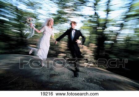 Married couple running View Large Photo Image Stock Photograph - Married couple running. Fotosearch