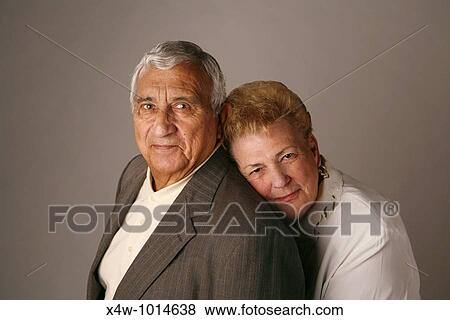 Married senior couple posing for studio portrait View Large Photo Image Stock Photo - Married senior couple posing for studio portrait. Fotosearch