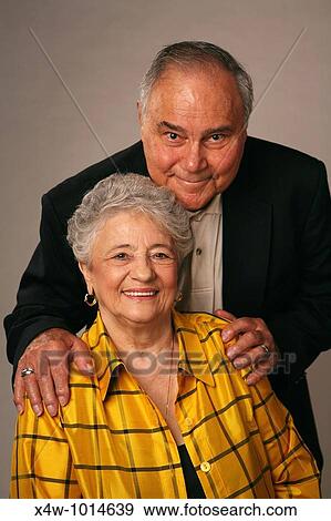 Married senior couple posing for studio portrait View Large Photo Image Stock Photo - Married senior couple posing for studio portrait. Fotosearch