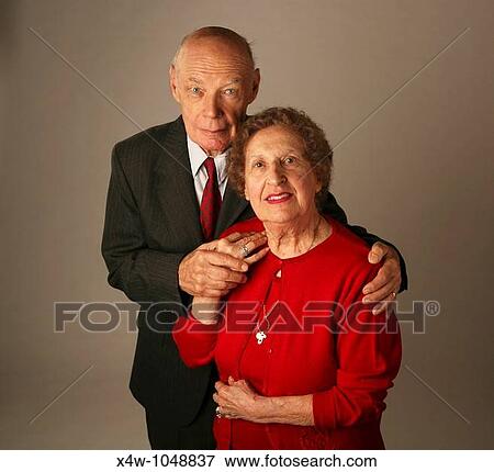 Stock Photo - Married senior couple posing for studio portrait. Fotosearch