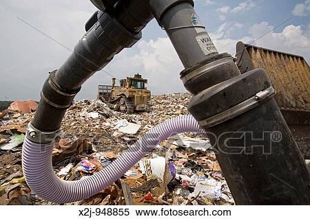 Marshall, Michigan - A well collects methane gas from decaying garbage at the C&C Landfill The methane is used by Gas Recovery Systems to generate electricity for distribution by Consumers Energy View Large Photo Image Stock Photography - Marshall, Michigan - A well collects methane gas from decaying garbage at the C&C Landfill The methane is used by Gas Recovery Systems to generate electricity for distribution by Consumers Energy. Fotosearch
