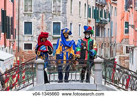 Masked persons on a bridge at the carnival in Venice, Italy, Europe View Large Photo Image Stock Image - Masked persons on a bridge at the carnival in Venice, Italy, Europe. Fotosearch